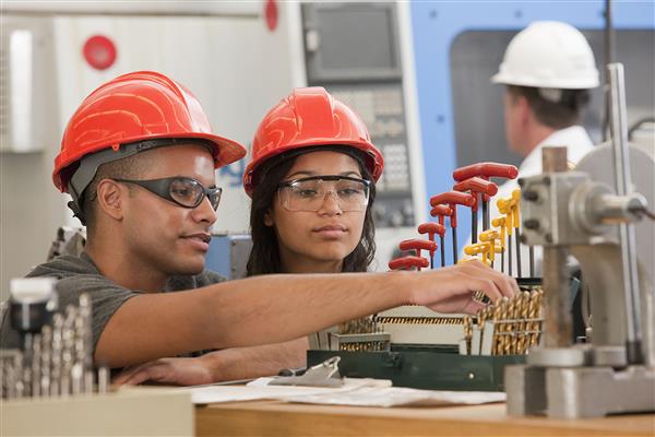 man and woman in hard hats 